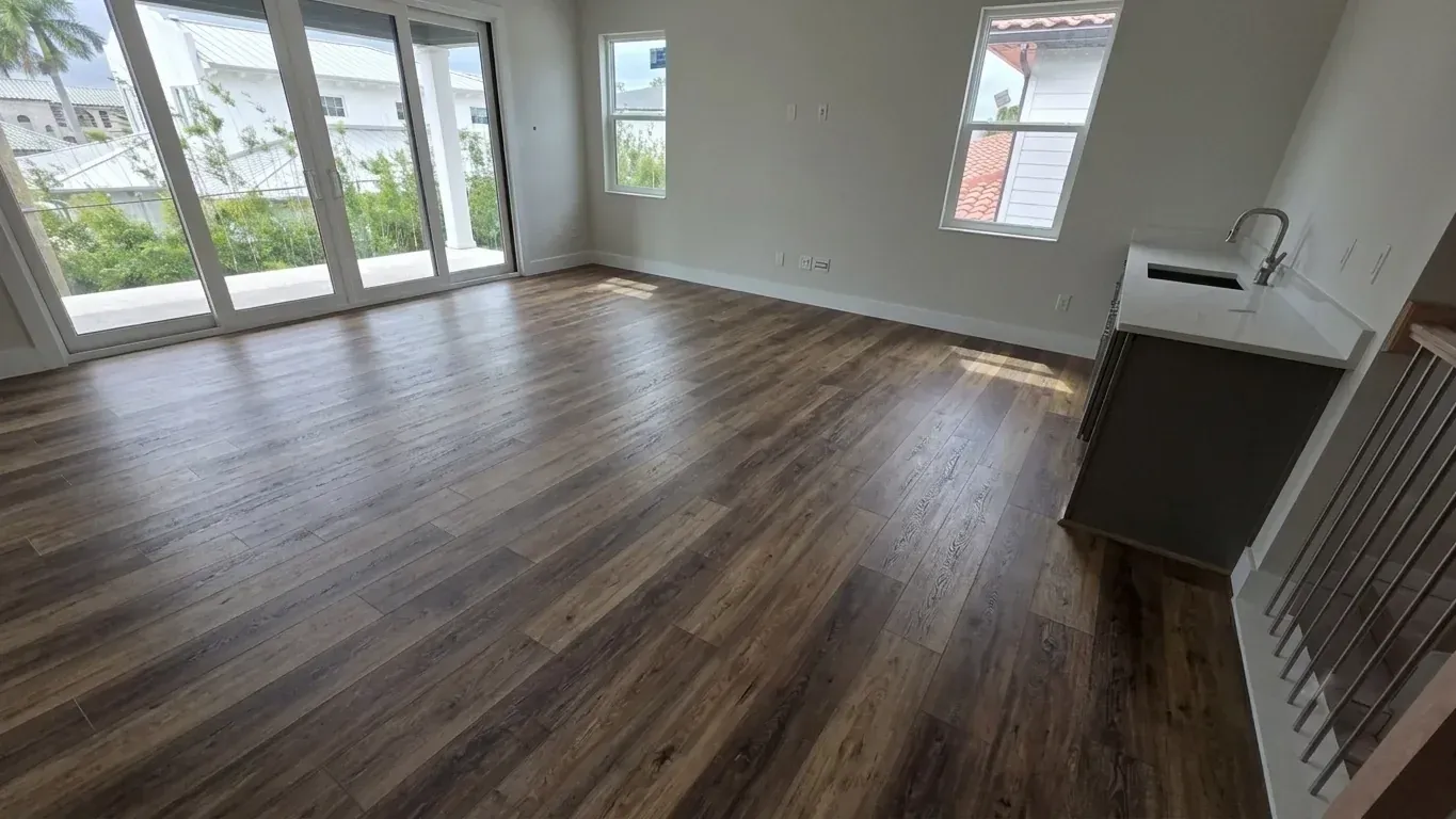 Seffner living room after installation of dark wood-look LVP flooring throughout the open floor plan
