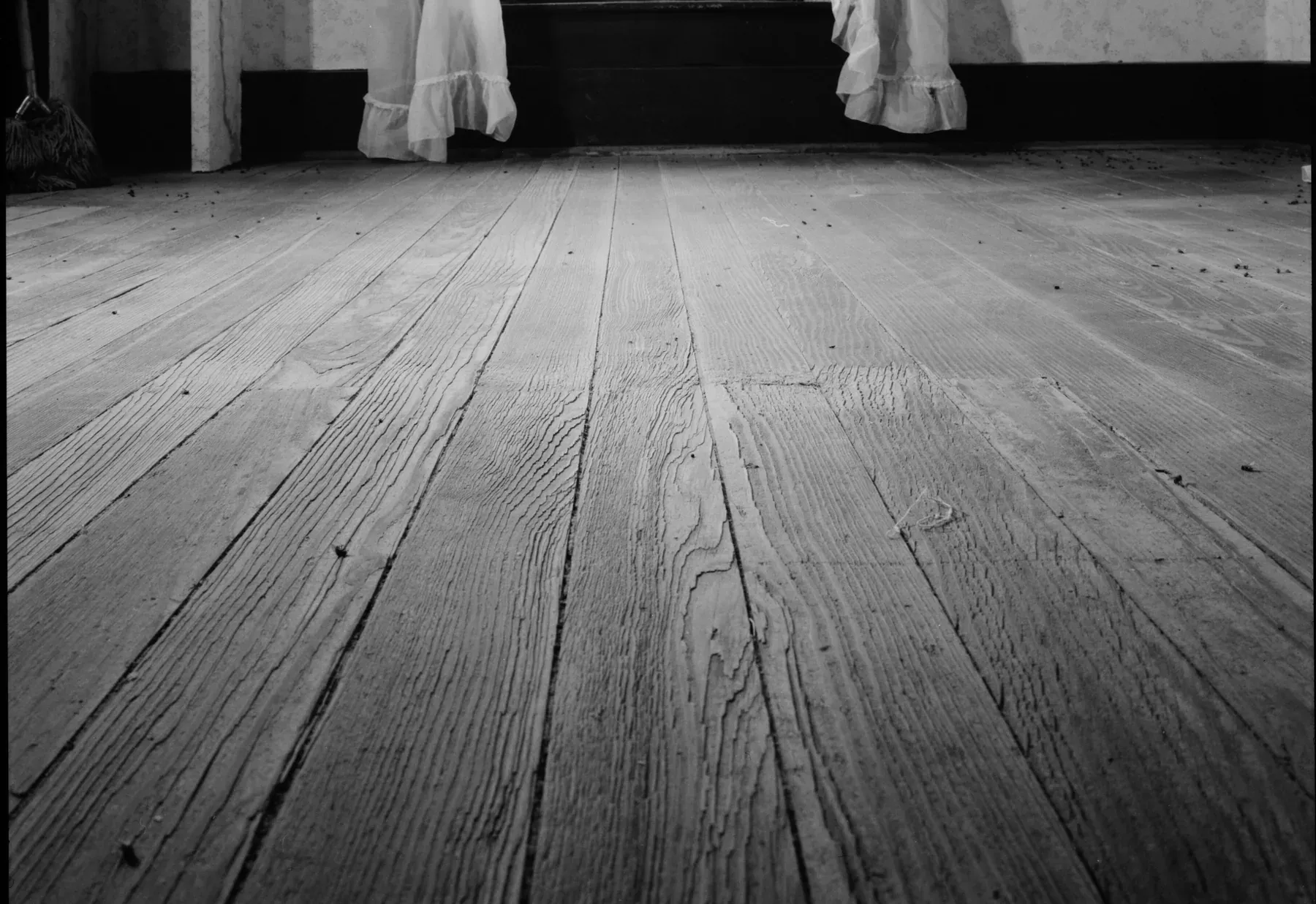 Worn wide pine floorboards in an upstairs room of a stone farmhouse in Hope, Kansas, photographed for the Historic American Buildings Survey