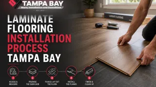 Laminate plank installation in progress across a prepared concrete slab in a Tampa home